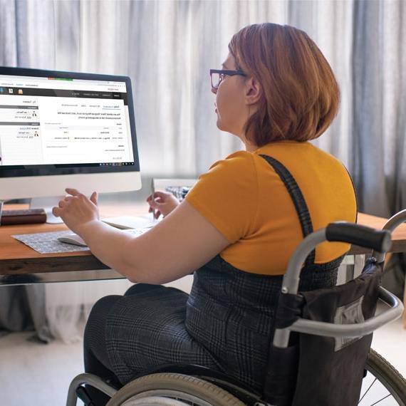 Caucasian female learning coach in wheelchair working at computer - Connections Academy